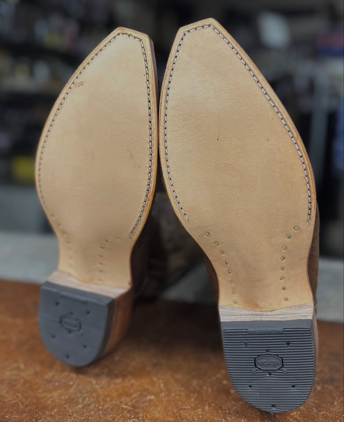 Vibram Cowboy heel installed on western boot - Fred's Shoe Repair