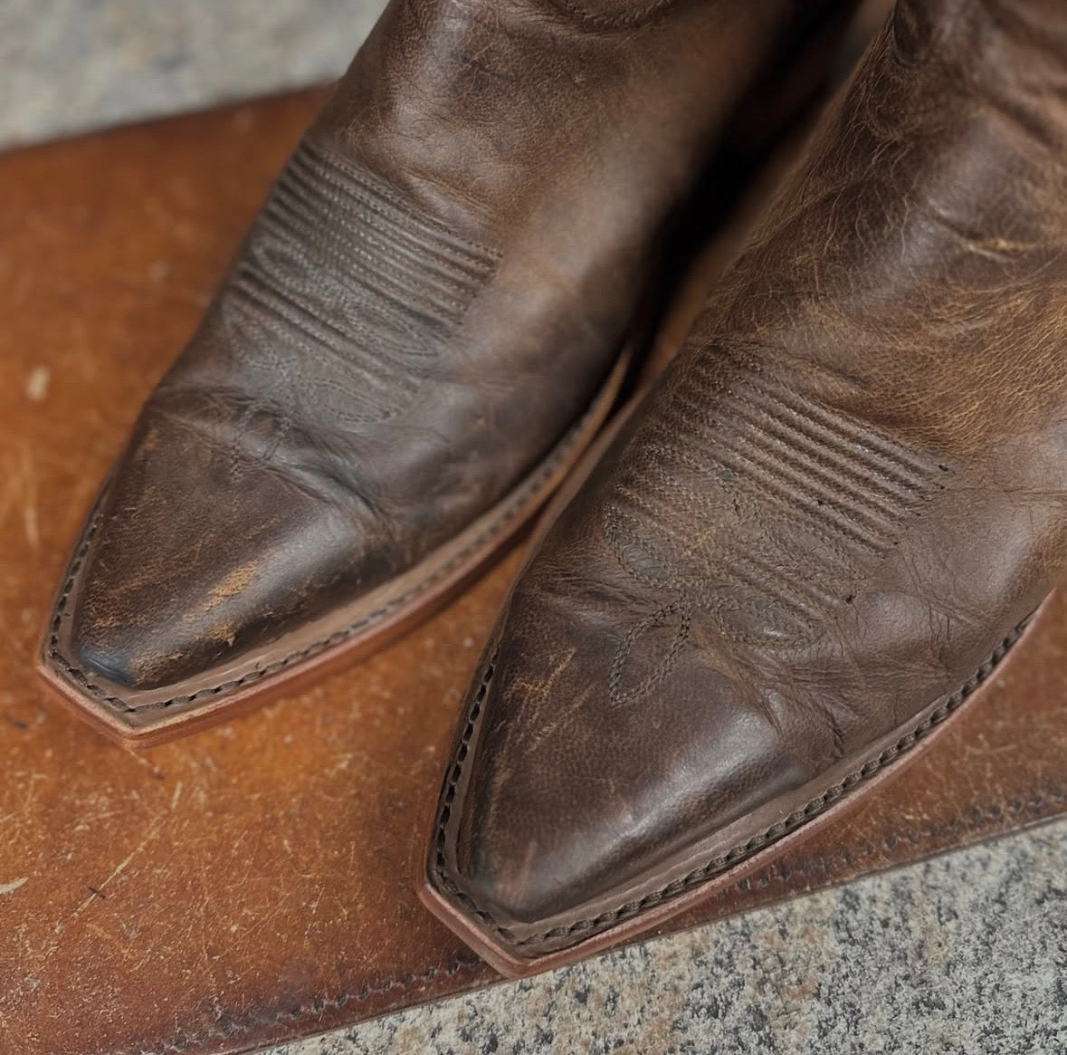 Cowboy boot leather sole and heel replacement service, new flat welts , brown stitching
